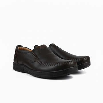 Pair of black leather shoes on a white background