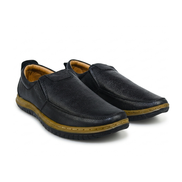 Pair of black  shoes with brown soles on a white background