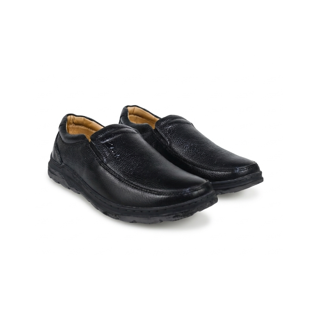 Pair of black slip-on shoes on a white background