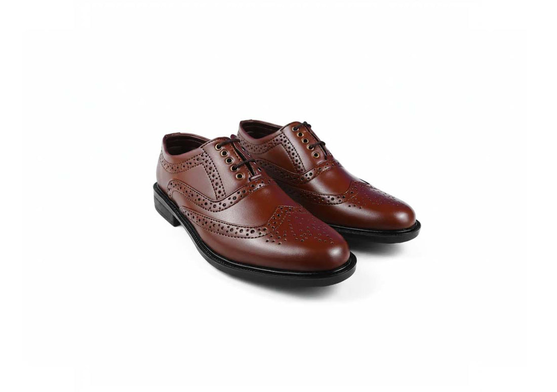 A pair of men's brown  wingtip oxford shoes with decorative brogue perforations, displayed on a clean white background.