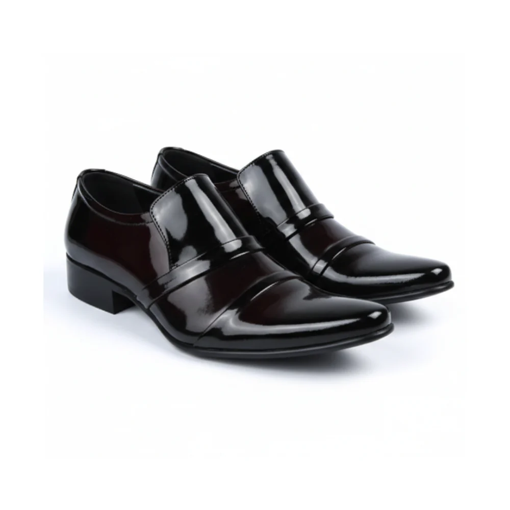 Pair of maroon dress shoes on a white background