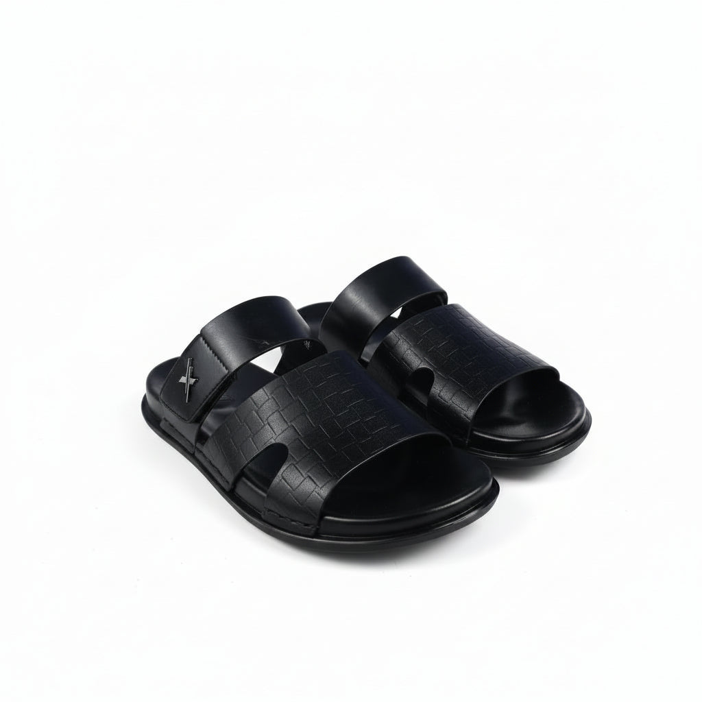 Black sandals with a unique sole design on a white background