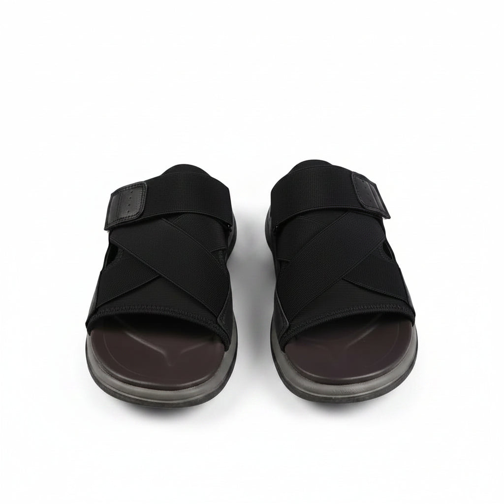 Black sandal with a strap on a white background