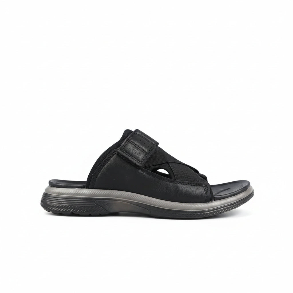 Black sandal with a strap on a white background