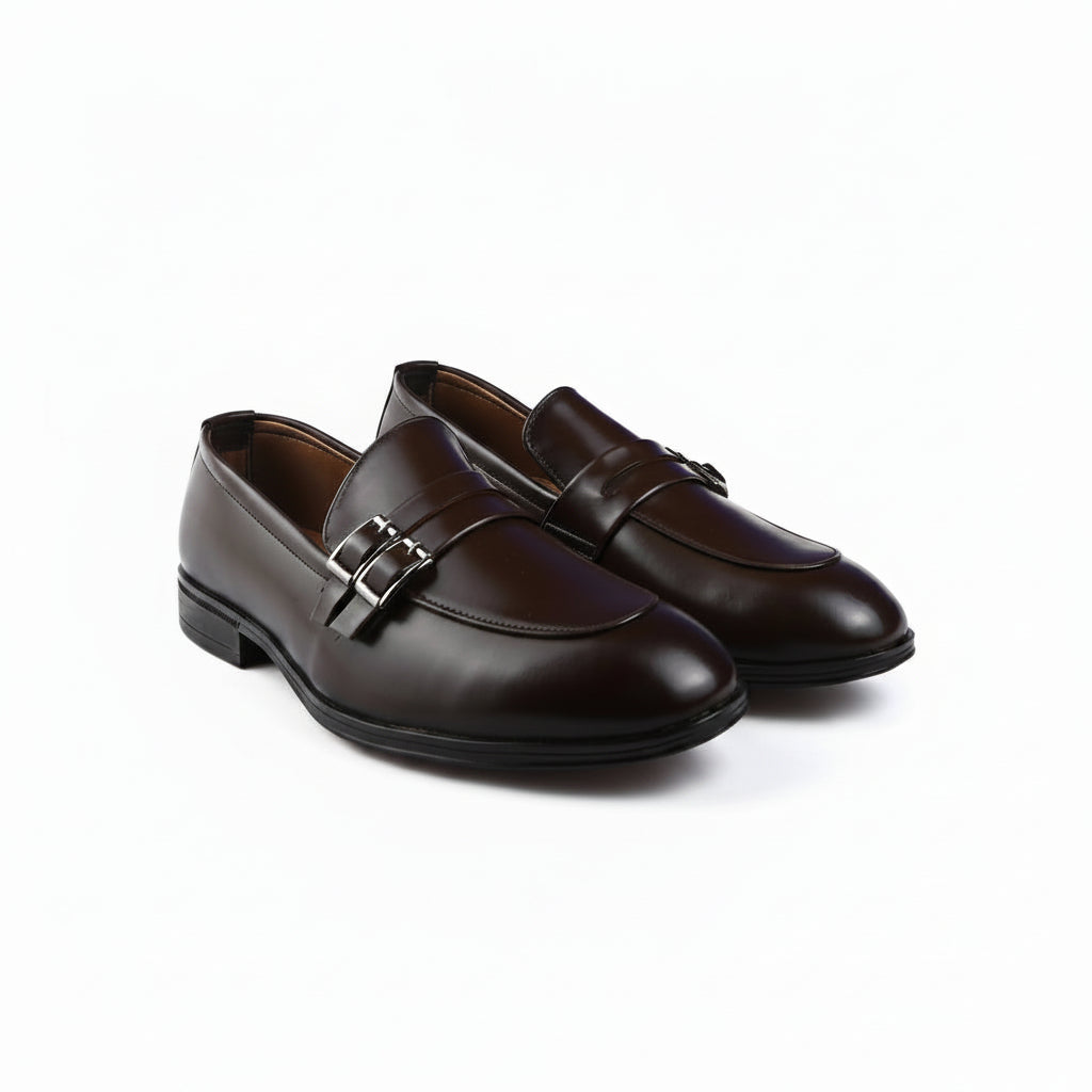 A pair of dark brown penny loafers with silver-tone buckle details, displayed on a clean white background.