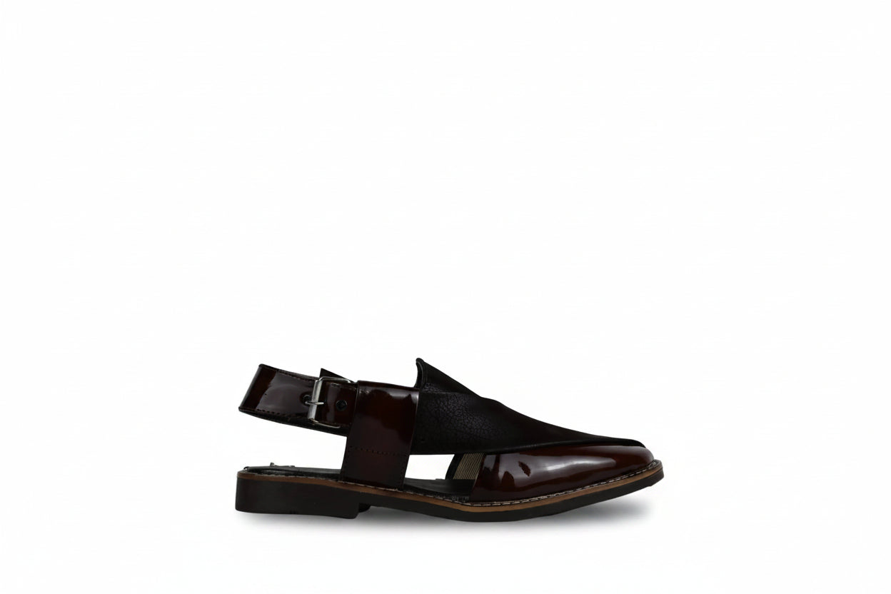 A single dark brown  khari-style sandal with a buckle ankle strap, shown in profile against a plain white background.