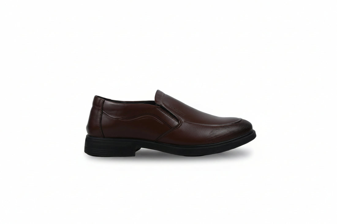 A pair of men's black  slip-on dress shoes with a subtle textured pattern on the toe and sides, displayed against a plain white studio background.