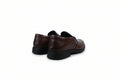 A pair of dark brown  slip-on loafers with black soles, shown from a rear three-quarter angle on a plain white background.