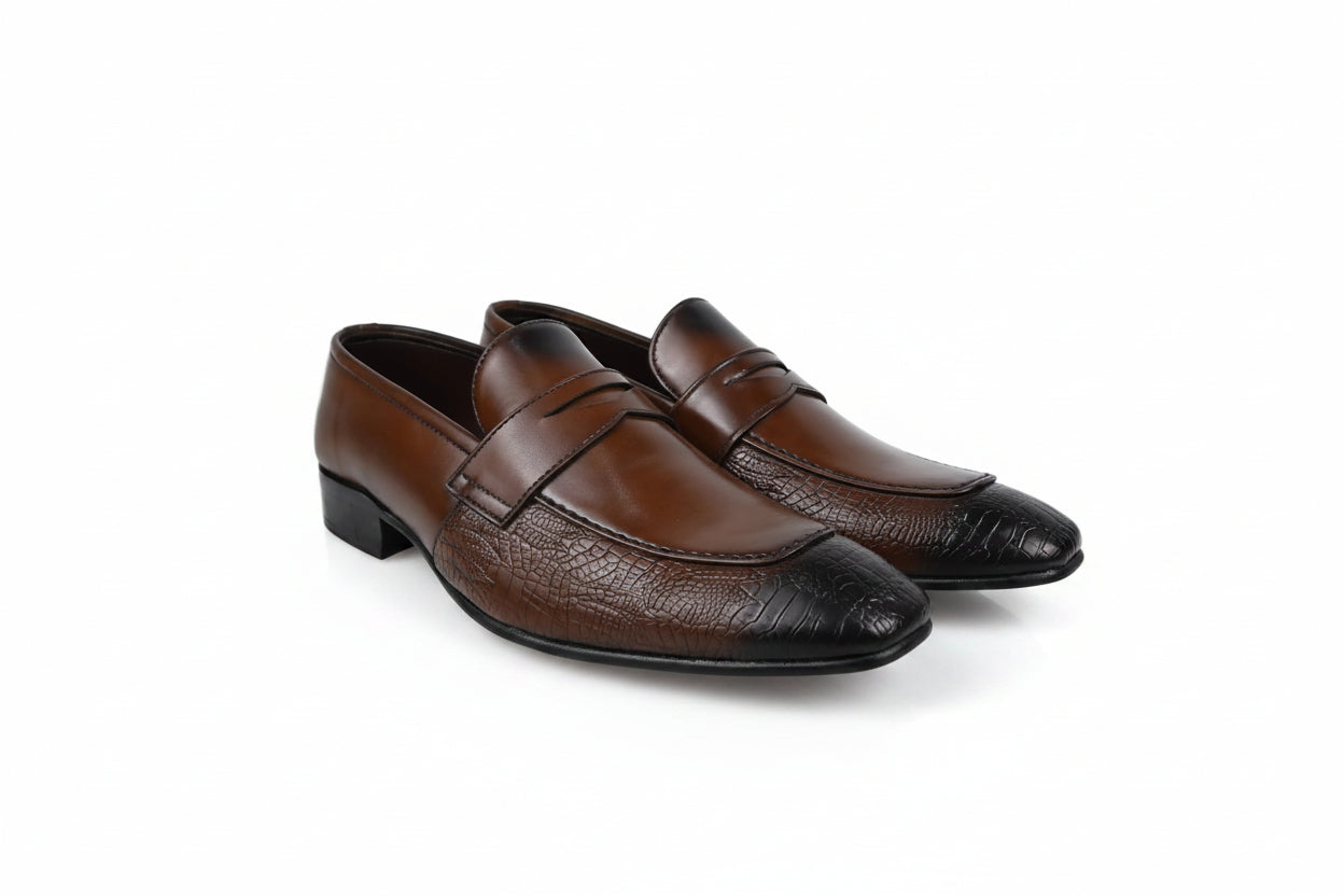A pair of men's brown  penny loafers with a textured crocodile pattern on the toe caps, displayed on a white studio background.