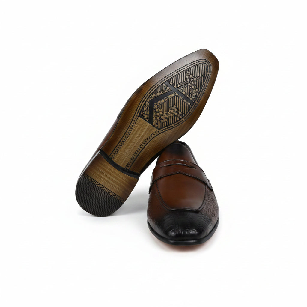 A pair of men's brown penny loafers, with one shoe standing upright to show the textured outsole and the other lying flat to show the side profile, set against a plain white background.