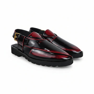 A pair of glossy black  clog-style loafers with deep red inlay panels and a small gold buckle detail, shown on a light gray background.