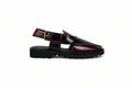 A single black  platform sandal with glossy red trim and a gold buckle, shown in profile against a light gray background.