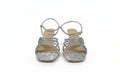 A pair of women's silver strappy sandals with rhinestone embellishments and square heels, shown against a plain white background.