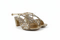 A pair of women's block-heel sandals in metallic gold with a textured, patterned woven design on the front straps, shown against a plain light gray background.