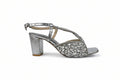 A single silver metallic block-heel sandal with an ankle strap and a wide front strap heavily embellished with silver rhinestones, shown against a light gray background.