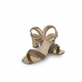 A pair of women's metallic gold block-heel sandals with a square toe, featuring a single front strap embellished with shimmering brown glittery fringe, set against a plain white studio background.