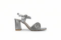 A single silver metallic high-heeled sandal with an ankle strap and a block heel, shown in profile against a light gray background.