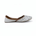 A single white flat shoe with silver metallic embroidery on the toe and a brown inner lining, shown from the side against a light gray background.
