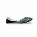 A single flat shoe with a dark green velvet heel and toe cap, and a white and green patterned fabric body, shown against a white studio background.