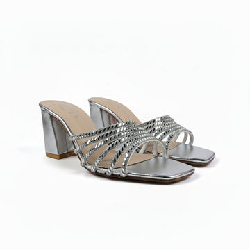 A pair of women's metallic silver heeled sandals with woven strap details and square toes, shown on a white studio background.