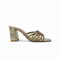 A single metallic gold heeled mule sandal with a block heel and crisscross woven straps, shown from a side profile on a light gray background.