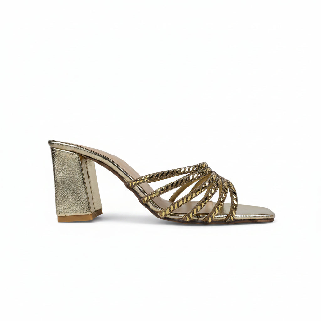A single metallic gold heeled mule sandal with a block heel and crisscross woven straps, shown from a side profile on a light gray background.