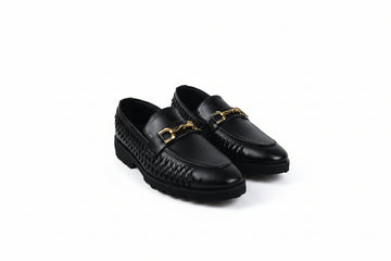 A pair of black leather loafers with a woven pattern on the sides and a gold-tone horsebit detail on the toe, displayed on a white studio background.