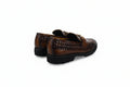 A pair of men's brown leather loafers with a woven pattern on the sides and a gold-tone buckle detail on the vamp, shown from a three-quarters angle against a white studio background.