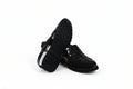 A pair of black leather woven sandals with a chunky lug sole, shown on a white studio background.