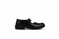 A single black leather Mary Jane school shoe with a hook-and-loop strap closure, shown from a side profile against a light gray fabric backdrop.