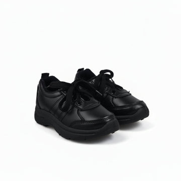 A pair of black low-top lace-up shoes with black soles, photographed on a plain white studio background.