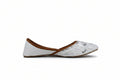 A single white flat shoe with a textured pattern on the toe, a brown strap across the instep, and a white heel, shown in profile against a light gray background.