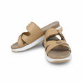 A pair of beige double-strap slide sandals with small gold-tone buckle details and white soles, shown on a plain white background.