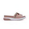 A single women's slide sandal in a dusty rose pink color, featuring a textured strap with a metallic gold chain accent and a thick white and pink sole, shown against a light gray background.