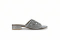 A single silver mule sandal with an embellished strap and a low block heel, shown from the side against a light gray background.