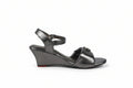 A metallic gray wedge sandal with an ankle strap and a small decorative buckle on the toe strap, shown from a side profile against a light gray background.