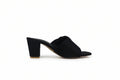 A single black mule sandal with a block heel and open toe, shown from a side profile against a light gray background.