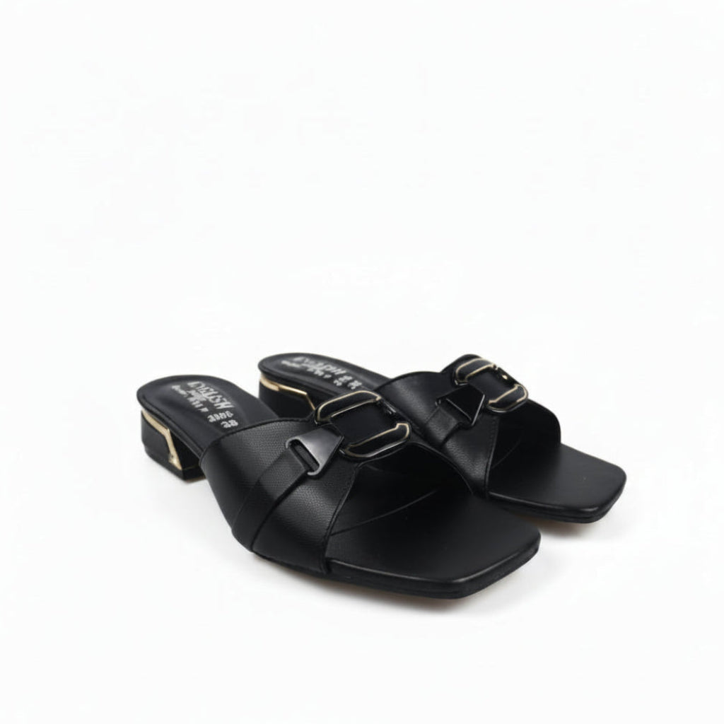 A pair of black leather slide sandals with square toes and double buckle straps, featuring a low block heel and gold-tone hardware, photographed on a light gray background.