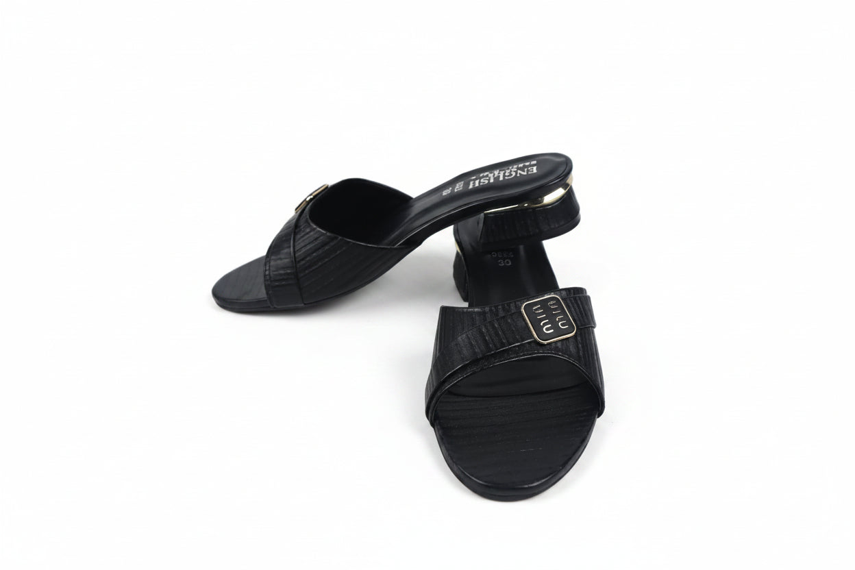 A pair of black leather slide sandals with textured straps and a block heel, featuring a gold-tone buckle detail on the strap and the brand name 'MARC SCALPR' printed on the insole.