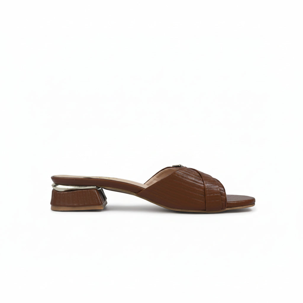 A single brown leather slide sandal with a textured, embossed pattern and a low block heel, shown from a side profile against a light gray background.