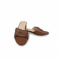 A pair of women's brown slide sandals with a textured crocodile-embossed strap and a low block heel, shown on a light gray studio background.