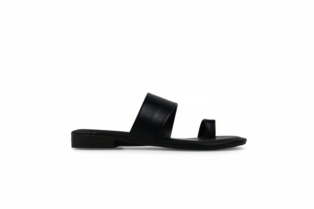 A pair of women's minimalist slide sandals in dark brown leather, featuring wide upper straps and a thong toe, displayed on a white studio background.