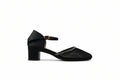 A single black block-heel Mary Jane sandal with a textured woven toe strap and a gold buckle, shown in profile against a light gray background.