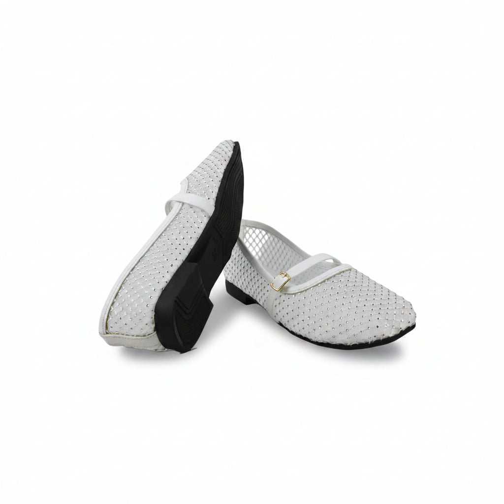 A pair of white woven slip-on shoes with black soles and a small gold buckle detail, displayed on a light gray studio background.