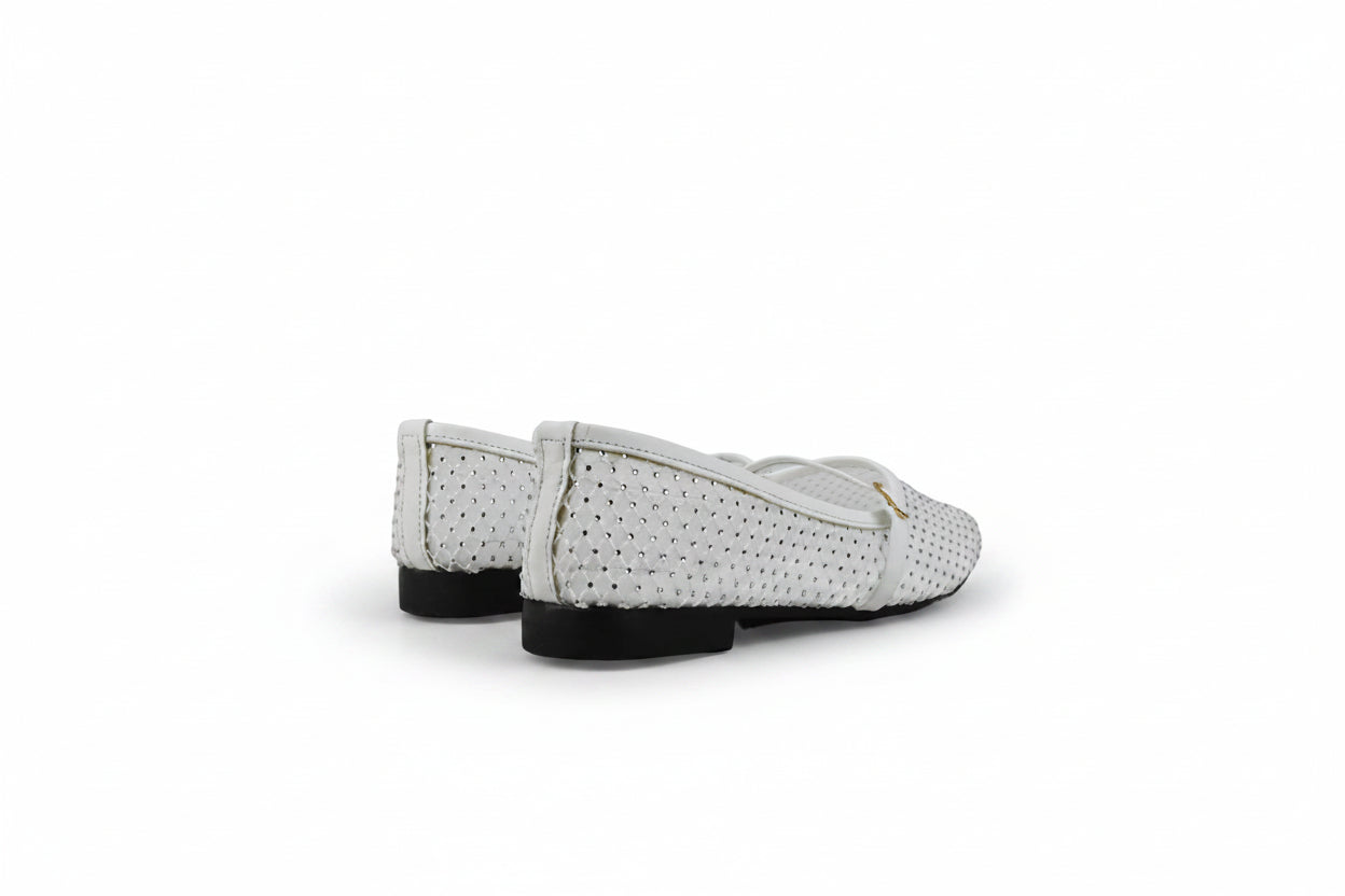 A pair of white woven leather ballet flats with perforated details and black soles, shown from a side-rear angle on a light gray studio background.