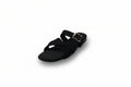 A single black flat sandal with crisscross straps and a gold-tone buckle, shown on a plain light gray background.