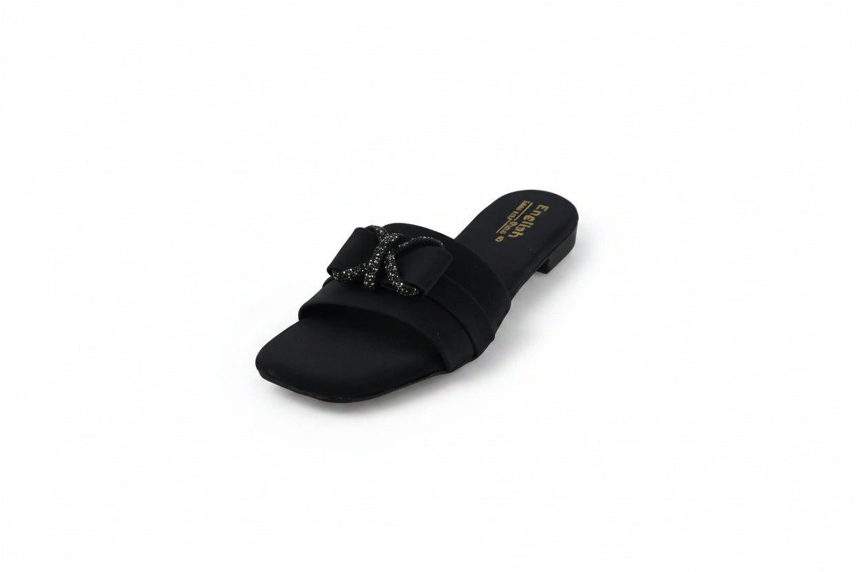 A single black slide sandal with a decorative rhinestone-embellished double strap and a low block heel, shown on a light gray background.