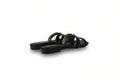 A pair of black leather slide sandals with double straps, shown from a side angle on a light gray studio background.