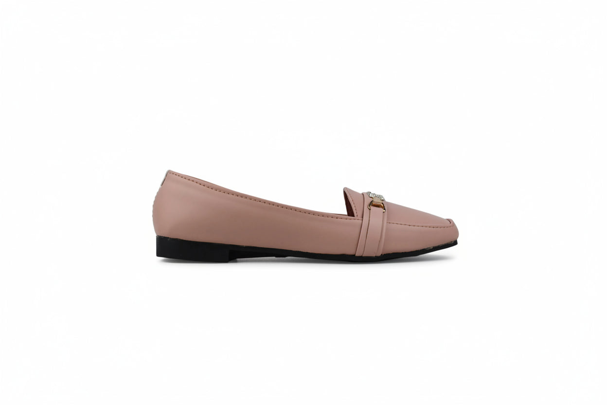 A single light pink leather loafer flat with a small gold-tone metal accent on the toe strap, shown in profile against a light gray background.