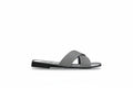A single flat slide sandal with two wide, textured gray straps and a black sole, shown from the side against a neutral gray background.